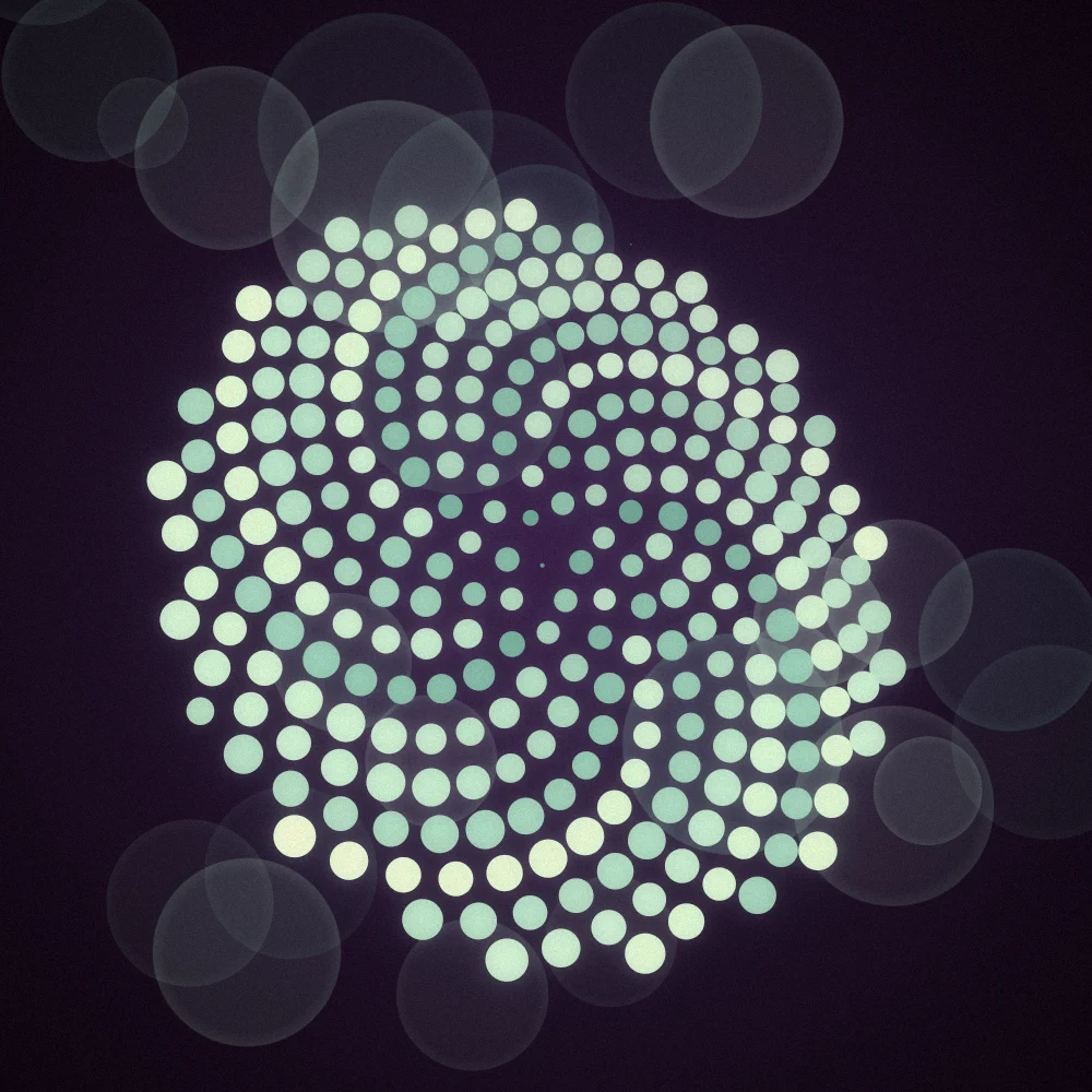 Glacier Sunwheel – Fibonacci · 136 circles · Glacier palette · bloom, film grain, warm grade, 3D depth, fit-to-canvas, depth sorting generated with Espiralito